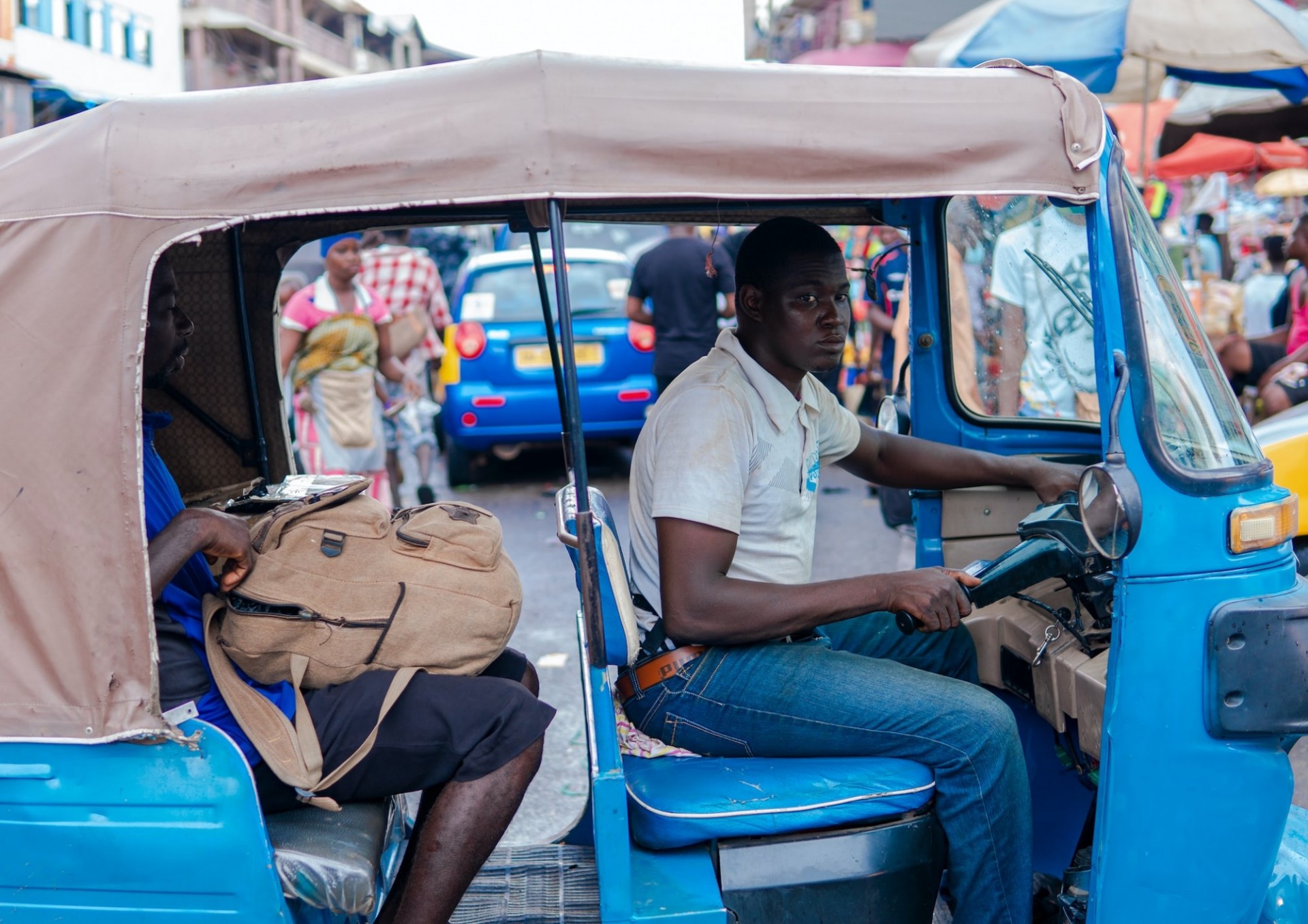 A driver navigates traffic in Kumasi, Ghana. DT4A’s “Beyond Mapping” project focuses on integrating transit data to improve management of the city’s informal transport networks. Photo: Kojo Kwarteng/Unsplash